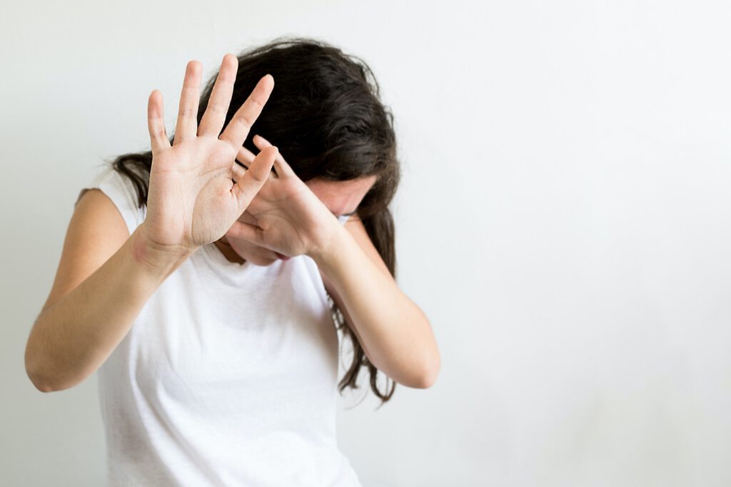 Female raised hands for self-defense